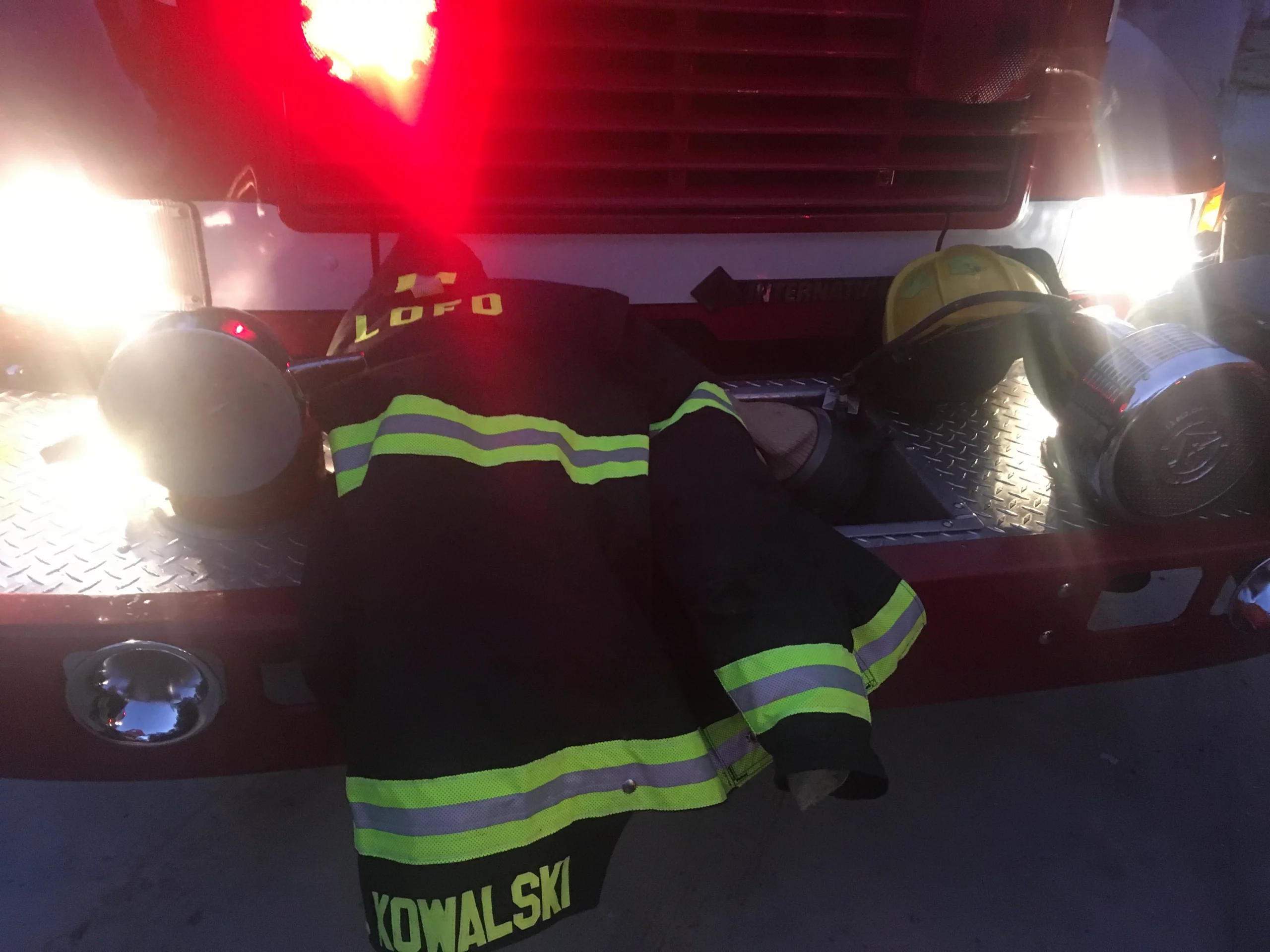 John R Kowalski's firefighter jacket rests on the fire truck.