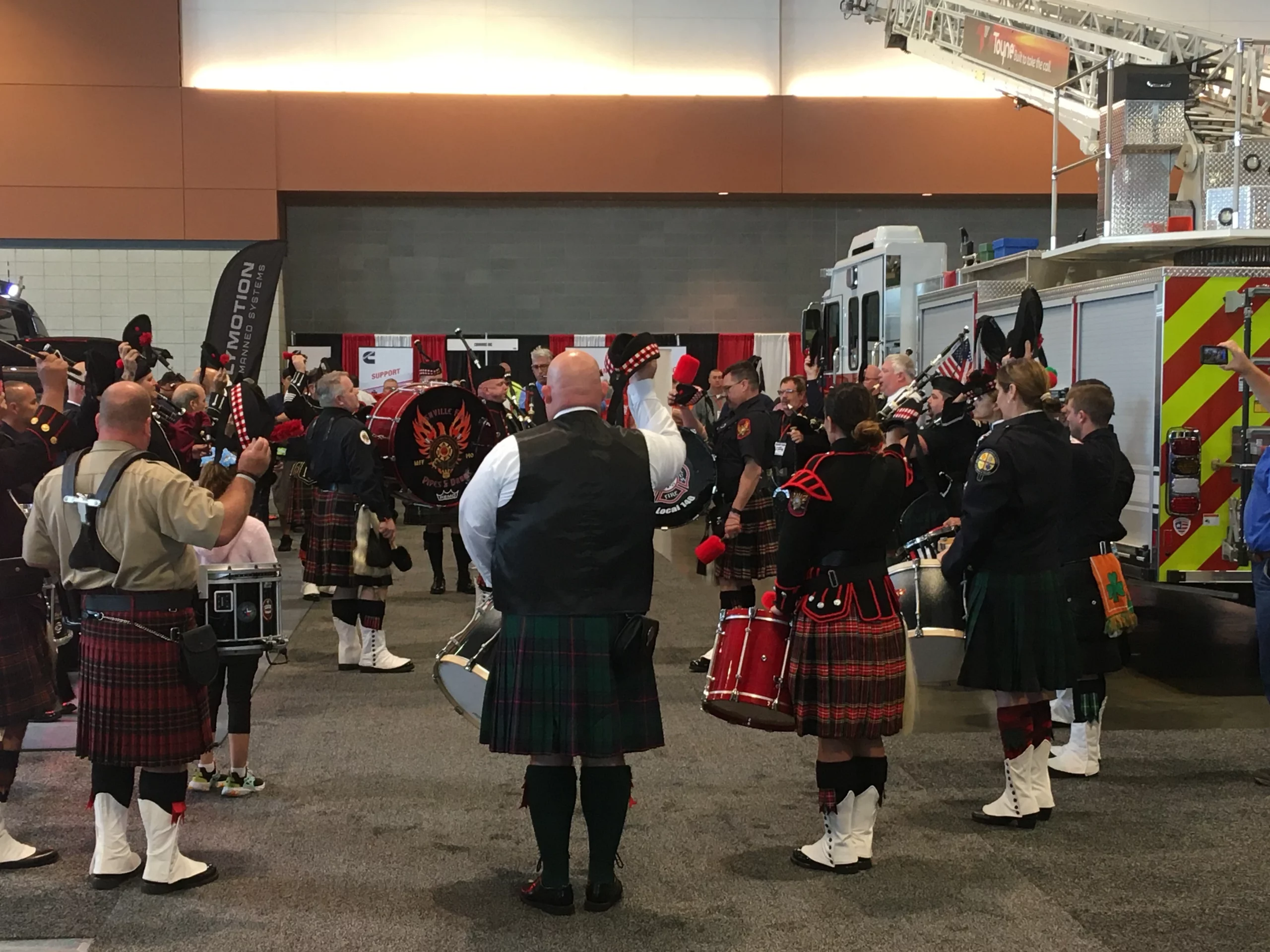 A firefighter bagpipe and drums unit performs at the 2019 Firehouse Expo.