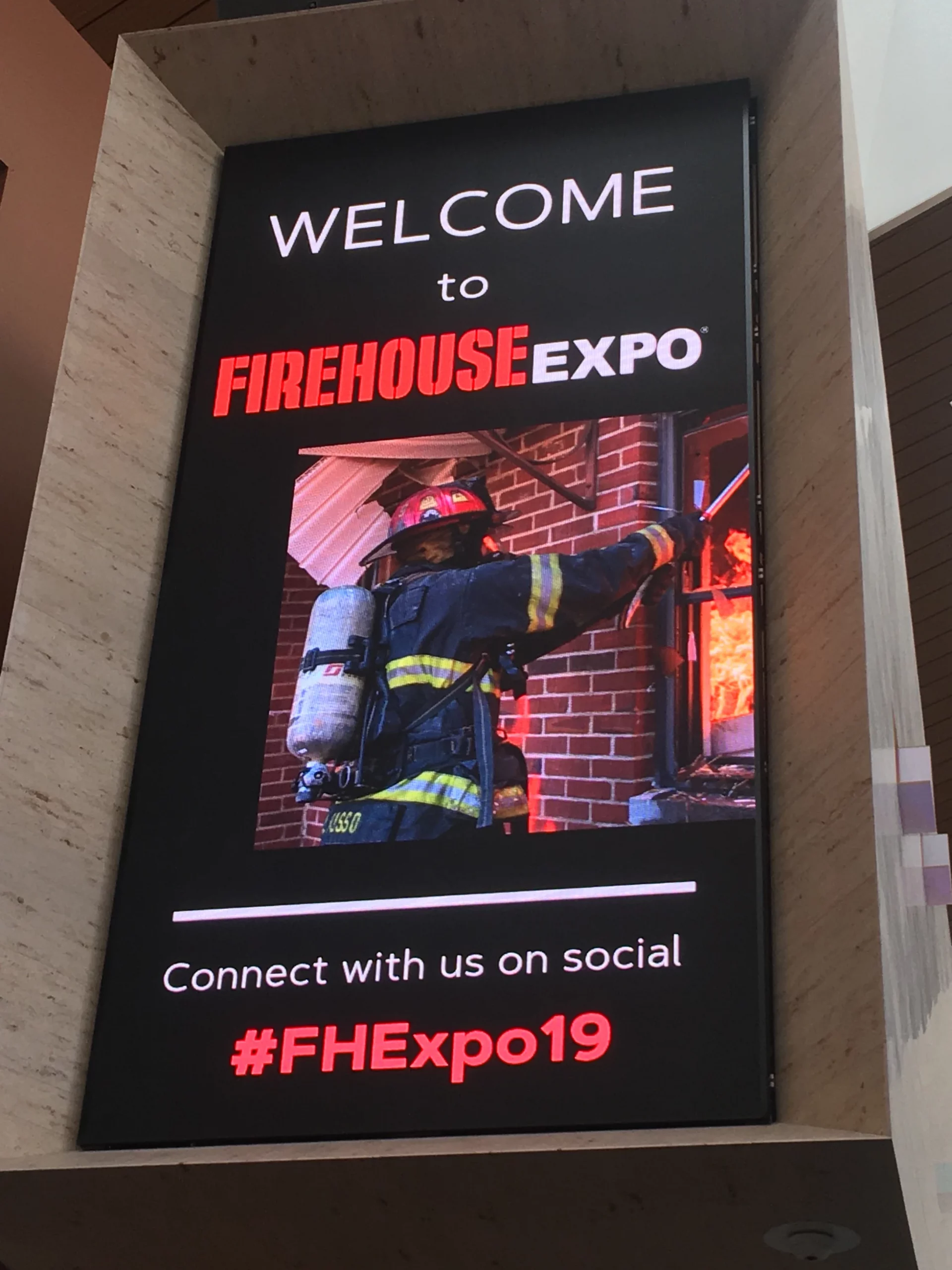 A digital sign reads, "Welcome to Firehouse Expo. Connect with us on social #FHExpo19."
